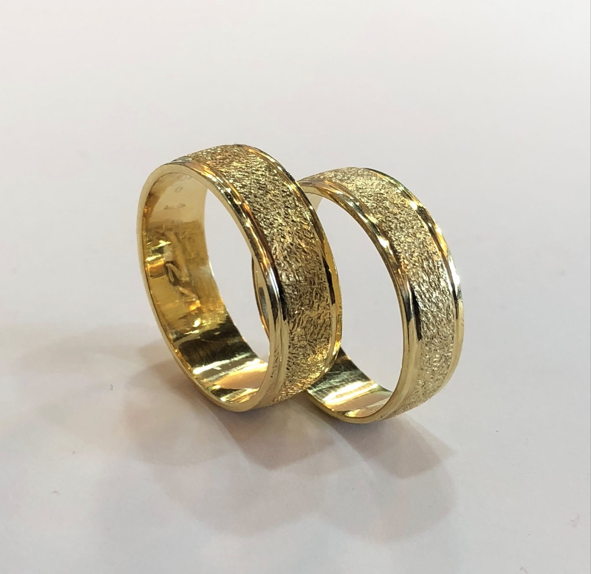Pair of textured gold wedding bands