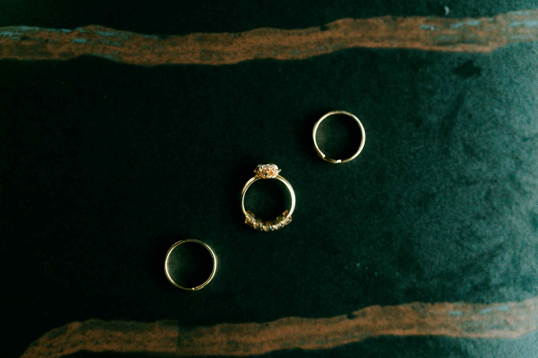 Gold rings on green velvet