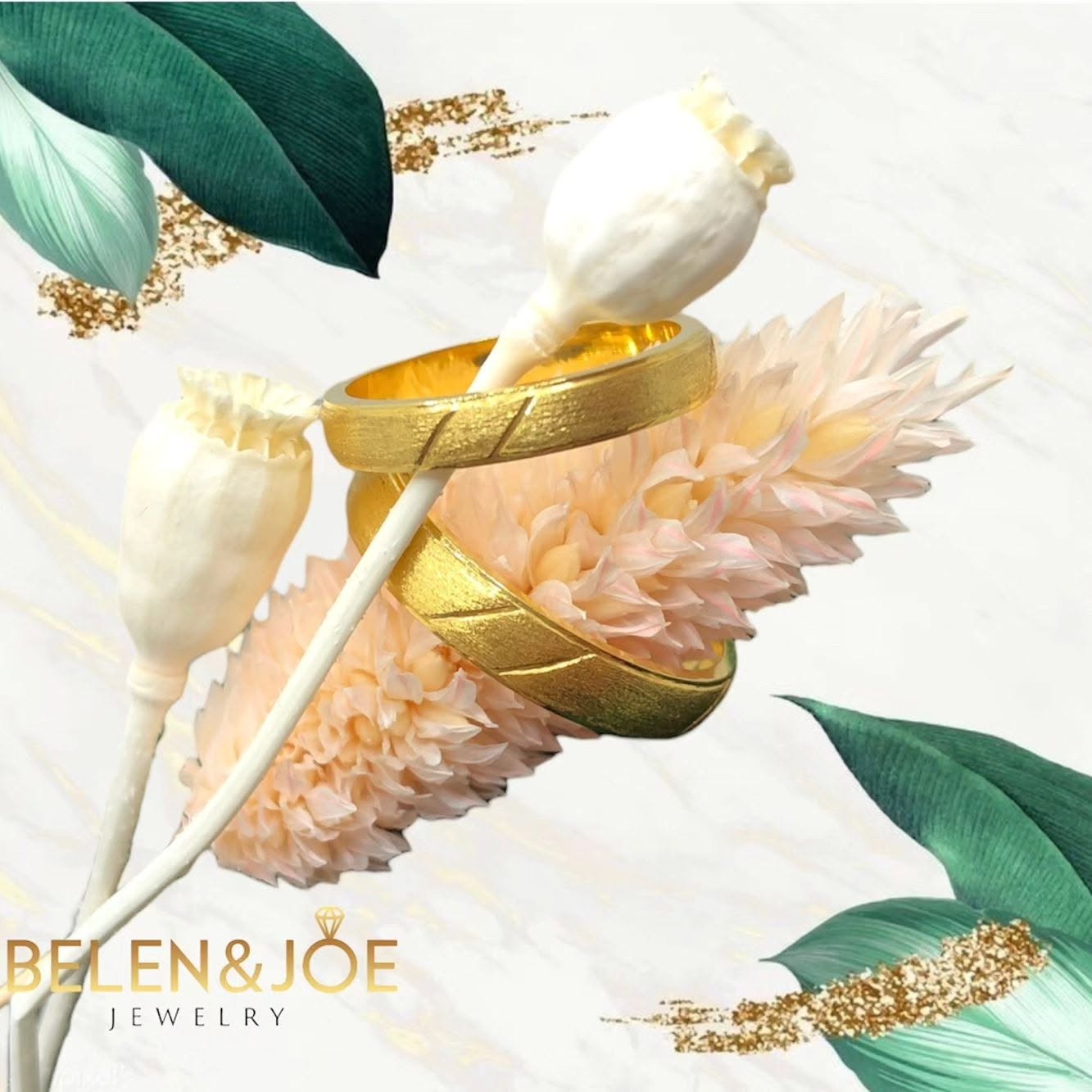 Gold rings styled with pampas grass