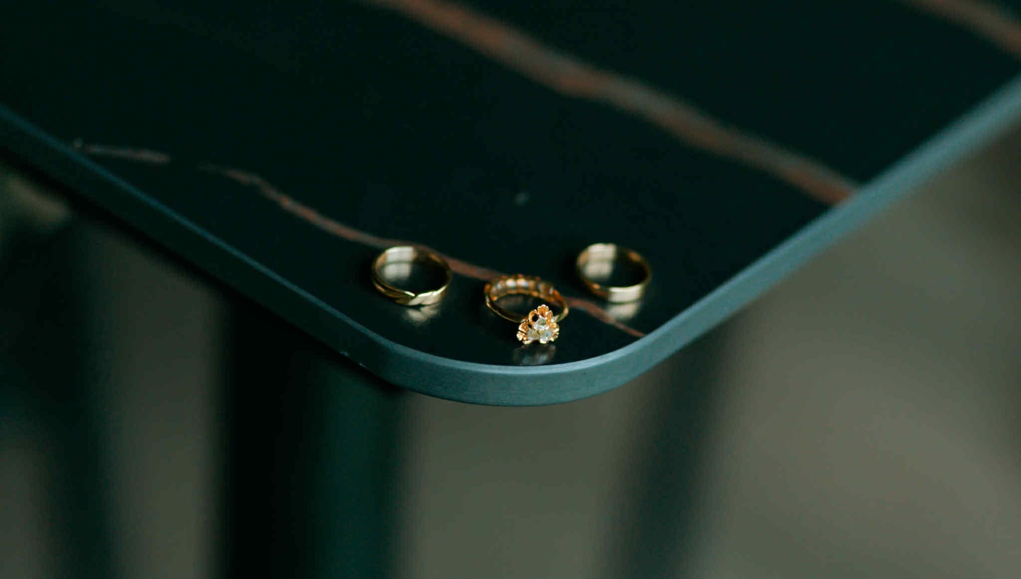 Gold rings resting on green velvet